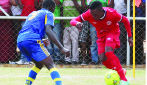 • NKANA midfielder, Shadreck Musonda (right) tries to dribble his way past Saka Mpiima of Uganda’s Kampala City Council Authority during the CAF Champions League match at Arthur Davies Stadium in Kitwe at the weekend. The game ended in a 2-2 draw. Picture by JEAN MANDELA