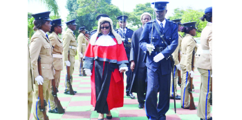 •ACTING Ndola High Court Judge-in-Charge Emelia Sunkuntu inspects a guard of honour during  the official opening of criminal sessions yesterday. Picture by MILDRED KATONGO 