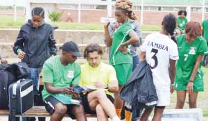 •FREE TIPS....Chipolopolo boss, Patrice Beaumelle exchanges notes with Zambia women team coach Charles Bwale after a training session at the Olympic Youth Development Centre in Lusaka in readiness for next weekend’s African Women Championship qualifier against Tanzania. Picture by SHAMAOMA MUSONDA