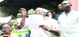 •NORTHERN Province Minister Freedom Sikazwe addresses PF members after receiving a petition on behalf of President Michael Sata and the Central Committee at the party’s office in Kasama yesterday. PF members are calling for urgent disciplinary action against Kasama Central Member of Parliament Geoffrey Mwamba for alleged gross misconduct. - Picture by WILLIE SITALI/ZANIS