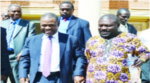 •JUSTICE Minister Wynter Kabimba (left) walks hand-in-hand with former Solwezi Central Member of Parliament Lucky Mulusa at the Supreme Court building in Lusaka yesterday after attending the opening of the Tribunal appointed to investigate him. Picture by STEPHEN KAPAMBWE