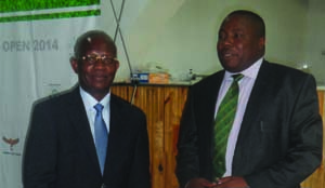 •ZAMBIA Open Organising Commitee (ZOOC) chairperson, Emmanuel Mutati (left) chats with Zambia Golf Union honorary secretary, Kelly Munsaka after a Press briefing at Nkana Golf Club in Kitwe yesterday. Picture by FELIX MALUNGA