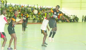 •NATHAN (in white) tries to block a pass from Mwenda Bwalya of Kasisi Dynamite during the club championship final at the Olympic Youth Development Centre.