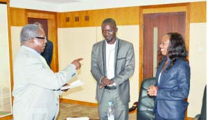 • INFORMATION and Broadcasting Services Minister Mwansa Kapeya (left) talks to National Association of Media Arts chairperson Patrick Salubusa and ZAMCORPS general manager Mutale Kaemba (right) at the signing of a Memorandum of Understanding in Lusaka yesterday. Picture by STEPHEN KAPAMBWE