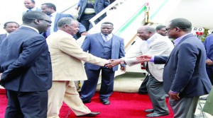 • PRESIDENT Michael Sata greets Finance Minister Alexander Chikwanda on arrival at Kenneth Kaunda International Airport yesterday. Looking on is Justice Minister Wynter Kabimba. Picture by EDDIE MWANALEZA