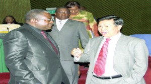 •MINISTER of Foreign Affairs Wylbur Simuusa talks to Chinese Ambassador to Zambia Zhou Yuxiao at a meeting with diplomats accredited to Zambia at Mulungushi International Conference Centre in Lusaka yesterday. Picture by STEPHEN KAPAMBWE