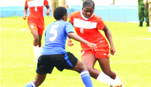 • ZAMBIA’S Hellen Mubanga (right) beats Fatuma Issa of Tanzania during the 2015 Africa Women Championship qualifier at Nkoloma Stadium in Lusaka yesterday. Zambia won 2-1. Picture by CLEVER ZULU