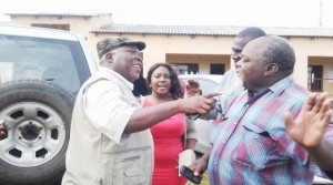• NORTHERN Province Minister Freedom Sikazwe (left) and United Party for National Development (UPND) Moomba Member of Parliament Vitalis Mooya (right) trying to resolve a dispute involving UPND Katuba Constituency by-election candidate Jonas Shakafuswa’s daughter Louise (centre). This was at North Park School polling station in Kabangwe yesterday. Picture By CHUSA SICHONE