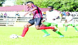 •ZANACO forward Rodrick Kabwe tries to shield the ball from National Assemblies player Evans Mwanza during the MTN/FAZ Super Division Week 1 match played at Woodlands stadium in Lusaka yesterday. The match ended 2 - 2. Picture by CLEVER ZULU.