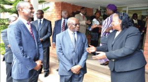 •ACTING Chief Justice Lombe Chibesakunda shares a light moment with Legal and Judicial Reforms Commission chairperson Frederick Chomba (centre) and Finance Deputy Minister Keith Mukata after the swearing-in ceremony of the commissioners in Lusaka yesterday. Picture by CLEVER ZULU