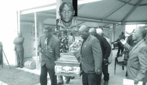 • FORMER Chipolopolo stars Dean Mwiinde (left) and Patrick Phiri among the pall bearers during late Kaiser Kalambo’s (insert) funeral procession at Lusaka’s Leopards Hill Memorial Park yesterday. Picture by ELIAS CHIPEPO.