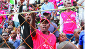 •NKANA fans cheering during the first leg of the CAF champions league first round match against Kampala City Council Authority played at Arthur Davies Stadium in Kitwe last Saturday. The game ended 2-2. Picture by JEAN MANDELA