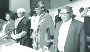 • LANDS Minister Mwansa Kapeya (right) officiating at the installation ceremony of Luanshya Mayor Gordon Siwale with out-going Town Clerk Alex Mwansa and deputy mayor Elizabeth Mulenga (far left). This was at the Luanshya Civic Centre grounds. Picture by GIDEON THOLE / LUANSHYA MUNICIPAL COUNCIL