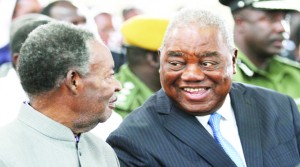 •PRESIDENT Michael Sata shares a light moment with former Republican president Rupiah Banda during the Good Friday church service at St Ignatius Catholic Church in Lusaka. Picture by EDDIE MWANALEZA