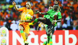 •FLASHBACK.....IVORY Coast striker, Didier Drogba (left) challenged by Zambian midfielder, Chisamba Lungu during the 2012 Africa Cup of Nations final match in Gabon. Zambia beat Ivory Coast on penalties to lift the continental trophy. Picture by MTN