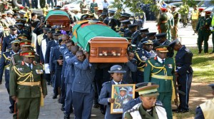 •PALLBEARERS arrive with the caskets for the late Zambia Air Force Deputy Commander Major General Muliokela Muliokela and Commanding Officer Colonel Brian Mweene at the Cathedral of the Holy Cross in Lusaka yesterday. Pictures by STEPHEN KAPAMBWE.