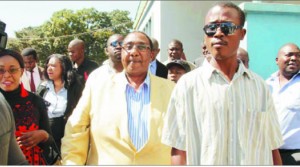 •FORMER Defence minister Geoffrey Bwalya Mwamba (in yellow jacket) with his sympathisers after appearing before Police at Lusaka Central Police Station yesterday. Picture by CLEVER ZULU