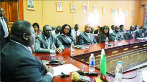 •TRANSPORT, Works and Communication Minister Yamfwa Mukanga (left) addresses the new Zambia Railways Limited Board members who include chairperson Davis Chama (second from left) Monde Limbali and Stephen Simukanga.  PICTURES By STEPHEN KAPAMBWE.