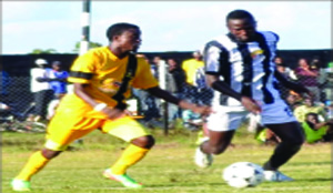 • POWER Dynamos midfielder Kennedy Mudenda (left) battles for the ball with defender, Given Sinyangwe of Roan United during the MTN Premier Division League Week Seven match at Kafubu Stadium in Luanshya yesterday. Picture by FELIX MALUNGA