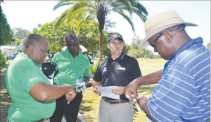 •ZAMBIA Open defending champion Adilson Da Silva of Brazil (third from left) shares tips with members of his group before teeing off from hole number one during yesterday’s Pro-AM at Nkana Golf Club in Kitwe. Picture by MOFFAT CHAZINGWA.