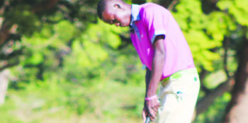 •ZAMBIA’S top junior golfer, Peter Munyinya putting on the 18th during the final round of the 2014 All Africa Junior Challenge at Chainama Hills Golf Club in Lusaka yesterday. Picture by JEAN MANDELA
