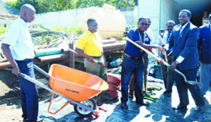 •OUTGOING Rotary Club of Ndola-Mukuba president Victor Chimuka (third from left), hands over a shovel to Seeds of Hope country director Sam Phiri during the donation of an assortment of equipment. Picture By GETHSEMANE MWIZABI