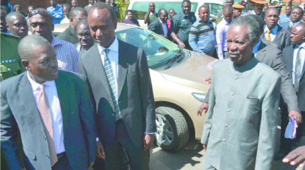 •President Michael Sata (right), Justice Minister Wynter Kabimba (left) and Lusaka Mayor Mulenga Sata leave the Lusaka High Court yesterday. Picture by STEPHEN KAPAMBWE