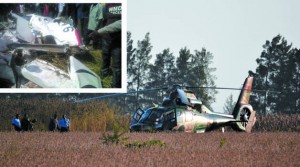 A Zambia Air Force (ZAF) helicopter and personnel inspect the site where a fatal air crash (insert) took place at York Farm on Mumbwa Road.