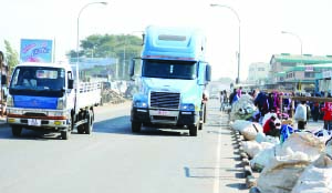 •CAREFREE vendors organise their merchandise along Lusaka’s busy Lumumba Road without minding heavy-duty trucks that pass less than a metre away.