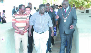 •Transport, Communication, Works and Supply Minister Yamfwa Mukanga (centre), Mufulira District Commissioner Chanda Kabwe and Mufulira Mayor Thomson Ngulube (right) during the handover and commissioning of Top Shops market shelter in Mufulira. Picture courtesy of Mufulira Municipal council