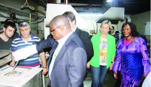 • MINES, Energy and Water Development Minister Christopher Yaluma learns
how to process gold, while Istanbul Gold Refinery Incorporation general
manager Aysen Esen (middle) and Zambian Ambassador to Turkey Miriam
Mulenga (far right) look on when he toured the plant in Istanbul City in Turkey on Tuesday. Picture by CHILA NAMAIKO