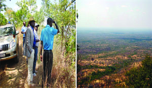 •NABWALYA Ward councillor Davis Chanda (right) shows Health Deputy Minister Chitalu Chilufya (in a hat) and his entourage on top of the Muchinga Escarpment the route to Chief Nabwalya’s area down the valley on the right. Picture By STANSLOUS NGOSA