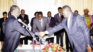 • PRESIDENT Michael Sata (left)congratulates new Supreme Court Judge Mumba Malila during a swearing-in ceremony at State House in Lusaka Yesterday. Picture by THOMAS NSAMA