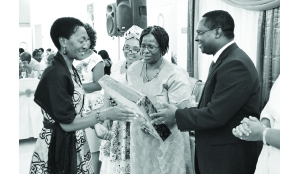 •GENDER in Development Department director in the Ministry of Gender and Child Development, Bupe Kaonga (centre) and Zambia Breweries corporate affairs director Luke Njovu (right) present the Most Improved Business Entrepreneur of the Year award to Naziya Investments proprietor Winnie Wachivula during the Month of the Woman Entrepreneur awards dinner at Government complex in Lusaka recently. Picture by STEPHEN KAPAMBWE.