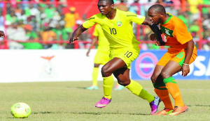 • FLASHBACK: Zambia’s Christopher Munthali trying to stop Mozambique’s Apsone David Manjare during the 2013 Council of Southern African Football (COSAFA) Senior Challenge quarterfinal match at Nkana Stadium in Kitwe. Zambia beat Mozambique 3-1. Picture courtesy of COSAFA