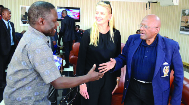 • GIRLS Not Brides, founder Archbishop Desmond Tutu (right) greets Deputy Inspector General of Police Solomon Jere (left) on arrival at Kenneth Kaunda International Airport. Looking on is Princess Mabel van Oranje. Picture by CLEVER ZULU.