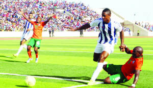 •CHIPOLOPOLO midfielder Fwayo Tembo goes down under the challenge of Admilson De Barros of Cape Verde during the 2015 Morocco Africa Cup of Nations (AFCON) Group F qualifier at Estadio Nacional in Praia on Wednesday. Cape Verde beat Zambia 2-1. Picture by MOSES CHIMFWEMBE