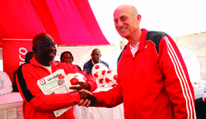 •MINISTRY of Education, Science, Vocational Training and Early Education Permanent Secretary Patrick Nkanza receiving a donation of 900 soccer balls and various financial fitness school materials from Zanaco managing director Bruce Dick at Sunset Stadium.