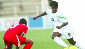 • SHEPOLOPOLO’S Hellen Mubanga tries to dribble past Namibia’s Lina Katuta during the 2014 Africa Women Championship (AWC) opening match at Sam Nujoma Stadium in Windhoek on Saturday. Picture courtesy of CAFONLINE
