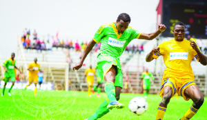 • ZESCO United striker Jackson Mwanza (left) shoots goalward as Napsa Stars’ White Mwanamwaba lurks behind during the Barclays Cup semi-final match at Arthur Davies Stadium in Kitwe at the weekend. Zesco won 1-0. Picture by KASUMPA KAPATA