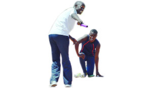 • National junior athletics coach, Kezzias Nyendwa (Left) gives tips to runner, Jonathan Katakula during yesterday’s training session in Lusaka for the African Union Sports Commission Region Five Games. Picture by SHAMAOMA MUSONDA