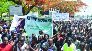 • A SEA of marketeers, street vendors, bus and taxi drivers march through Kitwe town centre in a procession to honour late President Michael Sata yesterday. Picture by MOFFAT CHAZINGWA