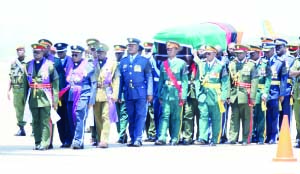 • Pall bearers carry the casket of late President Michael Chilufya Sata upon arrival yesterday at Kenneth Kaunda International Airport in Lusaka from London.