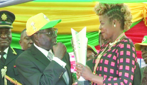 • ZAMBIA’S boxing heroine, Esther Phiri (right) receives an award from Zimbabwean President, Robert Mugabe at Barboufields Stadium, Bulawayo on Sunday for her contributions to sport development in Africa. Picture by SHAMAOMA MUSONDA