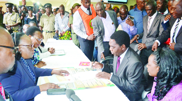 • UNITED Party for National Development president Hakainde Hichilema (second right) flanked by his wife Mutinta (right) filing his presidential nomination papers as acting Chief Justice Lombe Chibesakunda (centre, left) and Electoral Commission of Zambia chairperson Ireen Mambilima (third left) look on at the Supreme Court in Lusaka yesterday. UNIP president Tilyenji Kaunda and