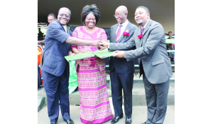 •FROM LEFT: Zambia’s Home Affairs Minister Ngosa Simbyakula, Zambia’s Tourism and Arts Minister Jean Kapata, Zimbabwe’s Home Affairs Deputy Minister Ziyambi Ziyambi and Zimbabwe’s Tourism and Hospitality Industry Minister Walter Mzembi (right) exchange the Memorandum of Understanding document at Victoria Falls Bridge.