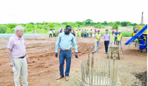 •ROAD Development Agency project manager for World Bank funded projects Nicholas Mulenga (right) looks at one of the piles for the Mufuchani Bridge on Kafue River in Kitwe. Looking on is resident engineer John De Lange. Picture by CLEVER ZULU