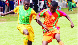 • ZAMBIA’S Chrispin Sakulanda (right) and Ismael Musanka of Zimbabwe compete for the ball during the final of the COSAFA Under-20 championship in Zimbabwe on Sunday. Zambia beat Zimbabwe 3-0. Picture by COSAFA