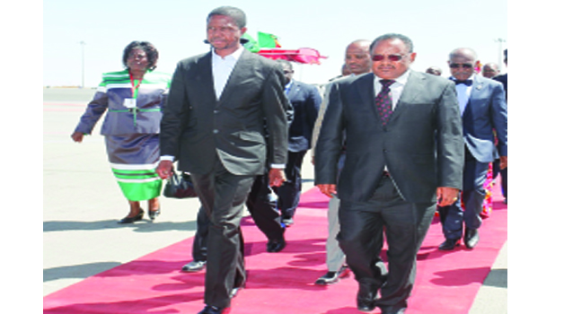 • PRESIDENT Edgar Lungu (left) with Ethiopian Minister of Sugar Corporation Shiferaw Jarso on arrival at Bole International Airport in Addis Ababa, Ethiopia yesterday. Picture by SALIM HENRY
