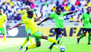 • ZAMBIA midfielder, Nathan Sinkala (right) in a tussle with Thamsanqa Sangweni of South Africa during a friendly match at Orlando Stadium in Johannesburg on Sunday. South Africa won 1-0.- Picture by SYDNEY MAHLANGU/BACKPAGEPIX